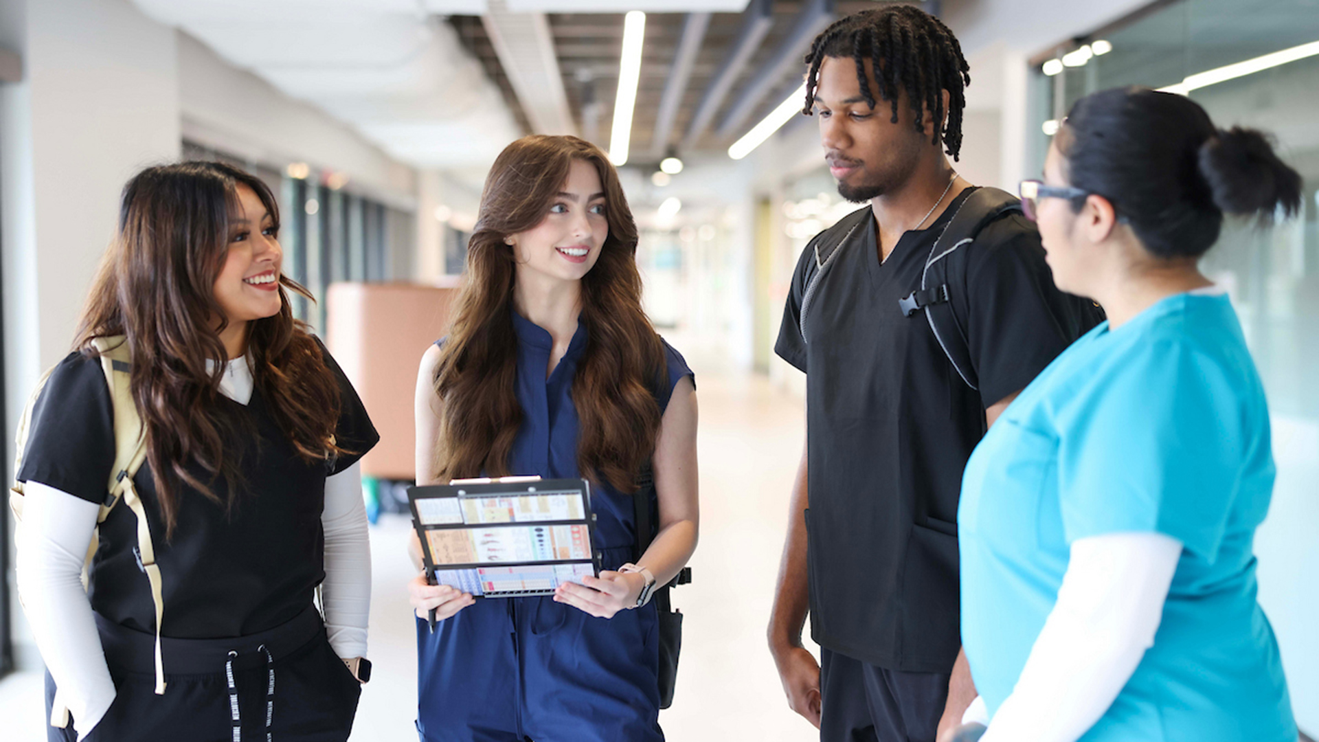 Nursing students talking in the hallway