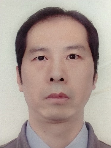 Xuewen Wang Man poses for photo with serious expression