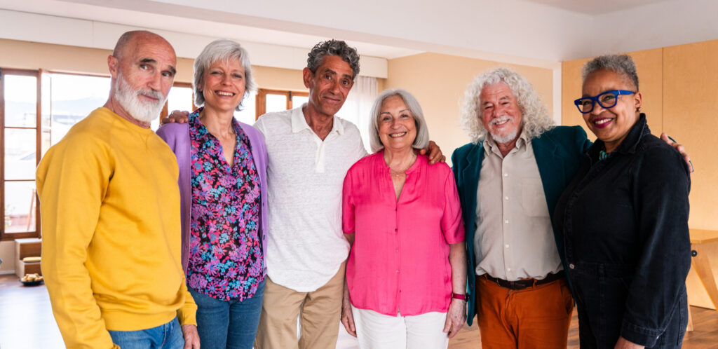 Group Of Senior Friends Bonding At Home For Dinner Party