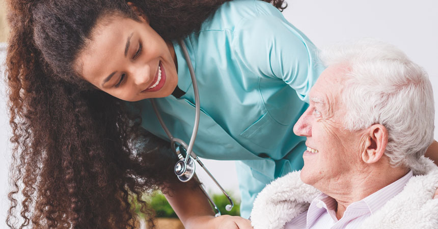 health care professional attends to older adult