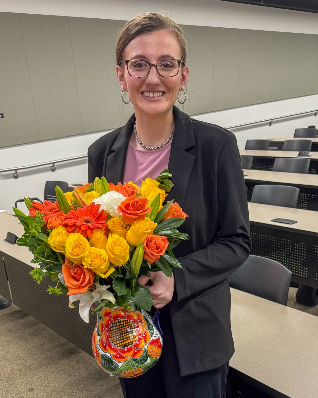 Student in classroom with flowers