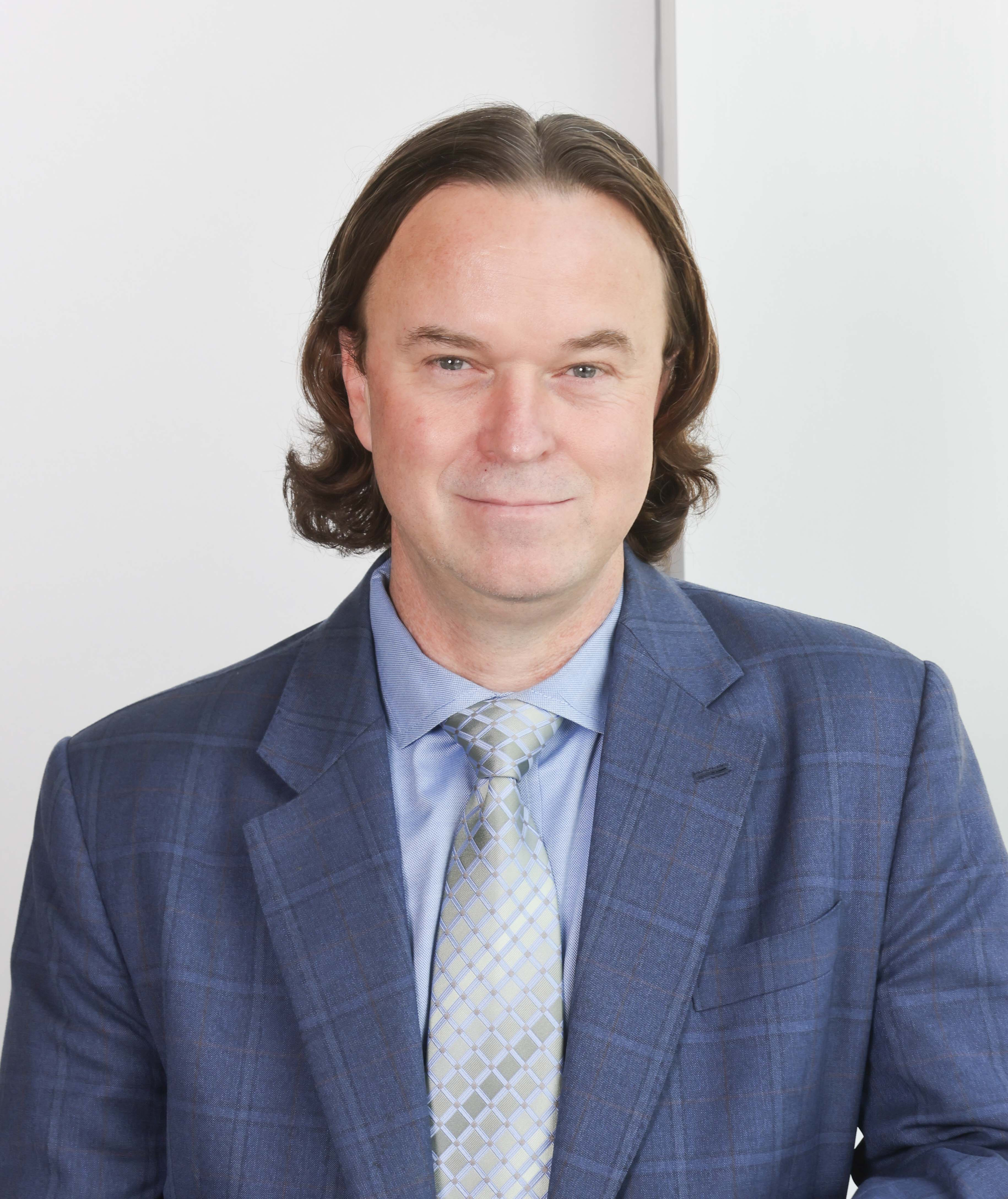 Jeff Beeson headshot with a light background