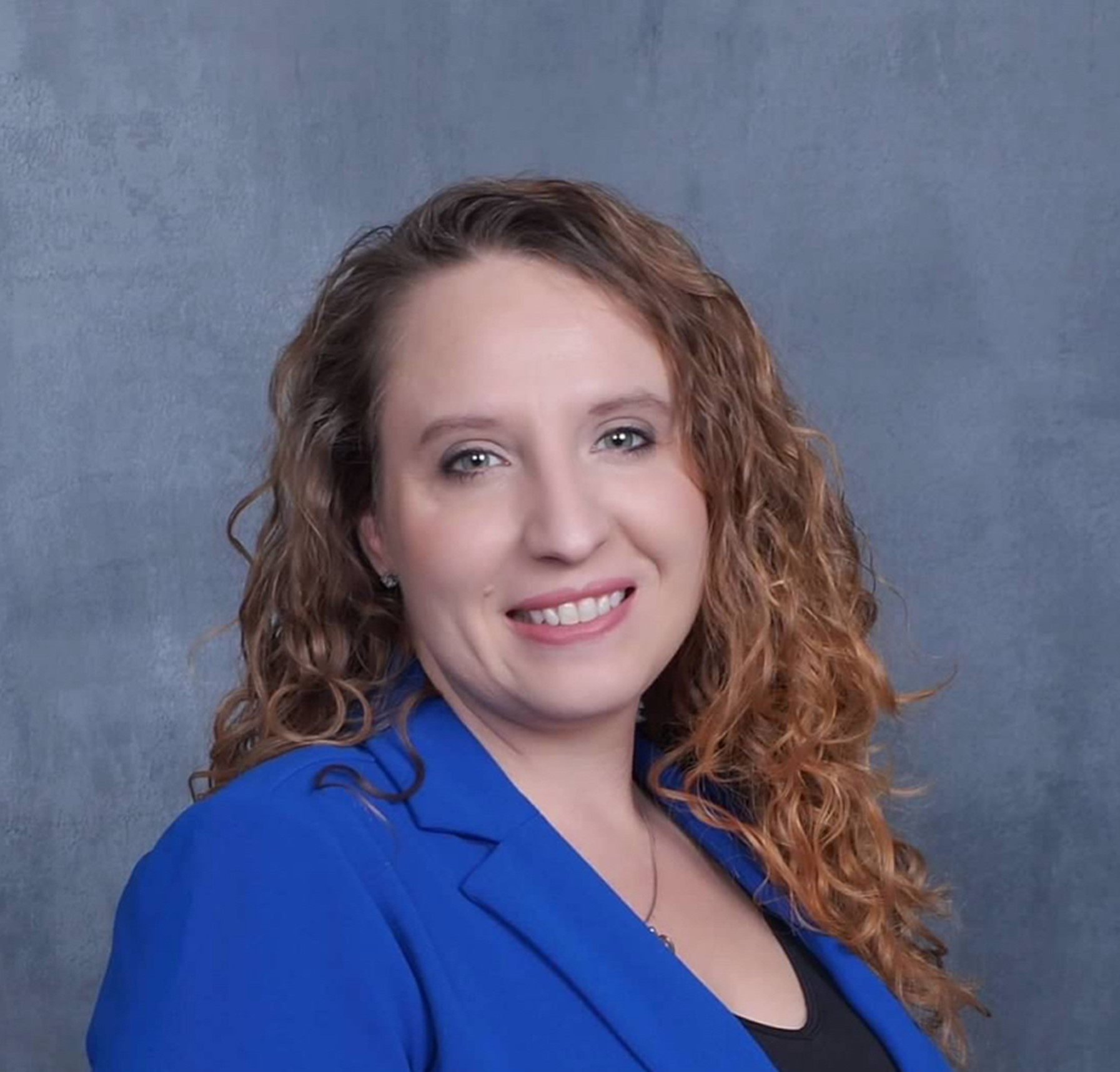 Linda Perna headshot wearing a blue jacket