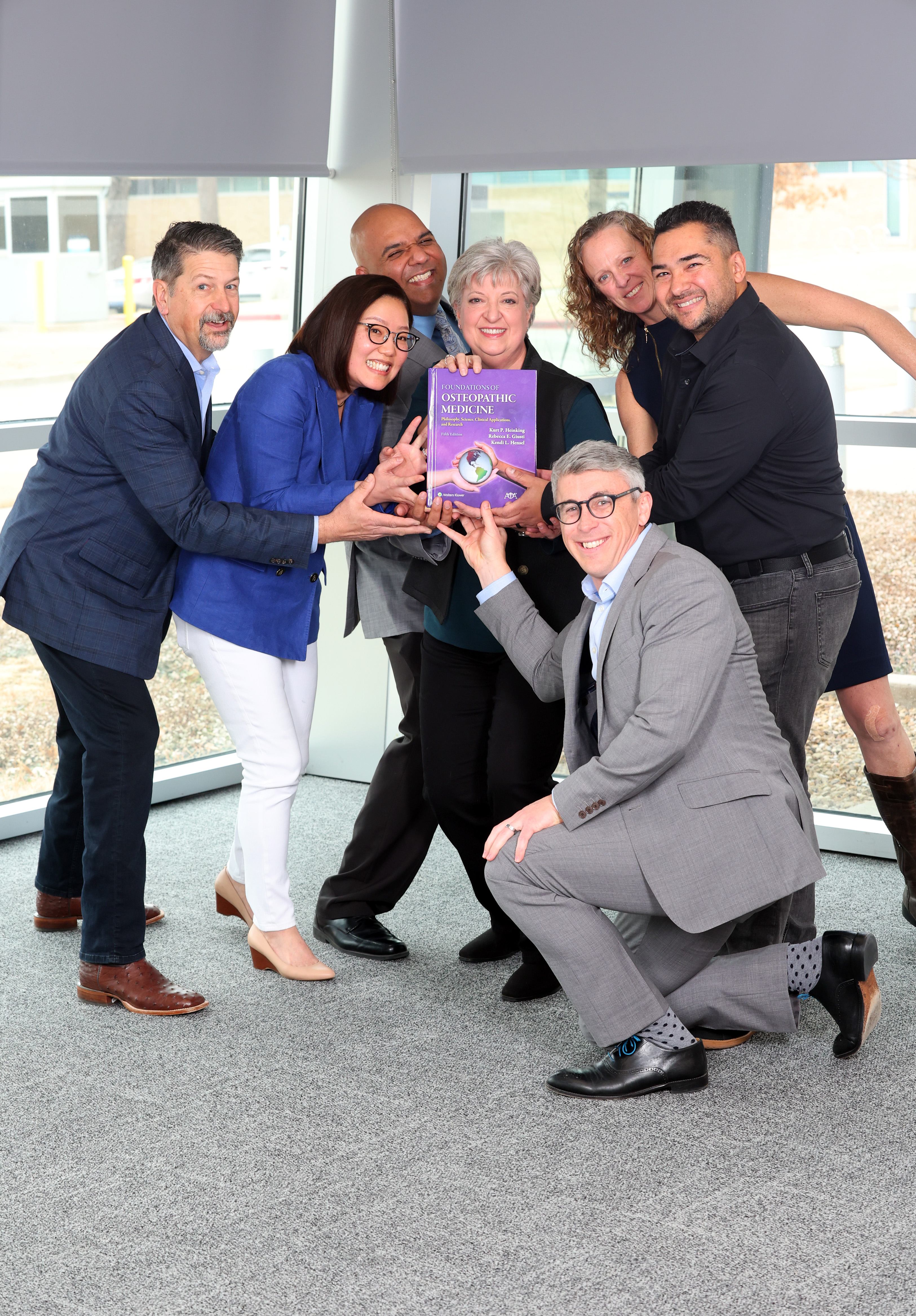 group photo with textbook