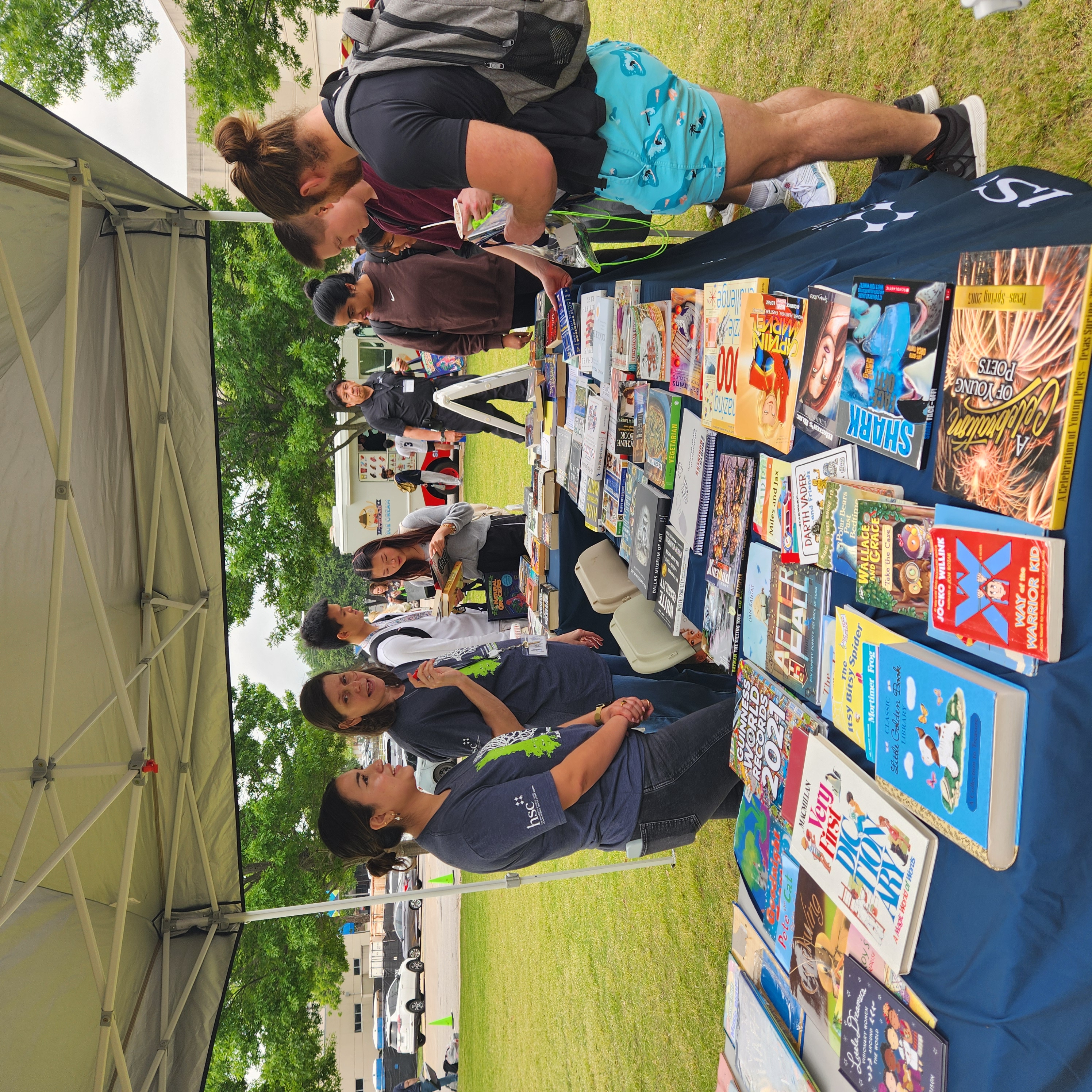 People attend a book swap at a previous Earth Day Fair