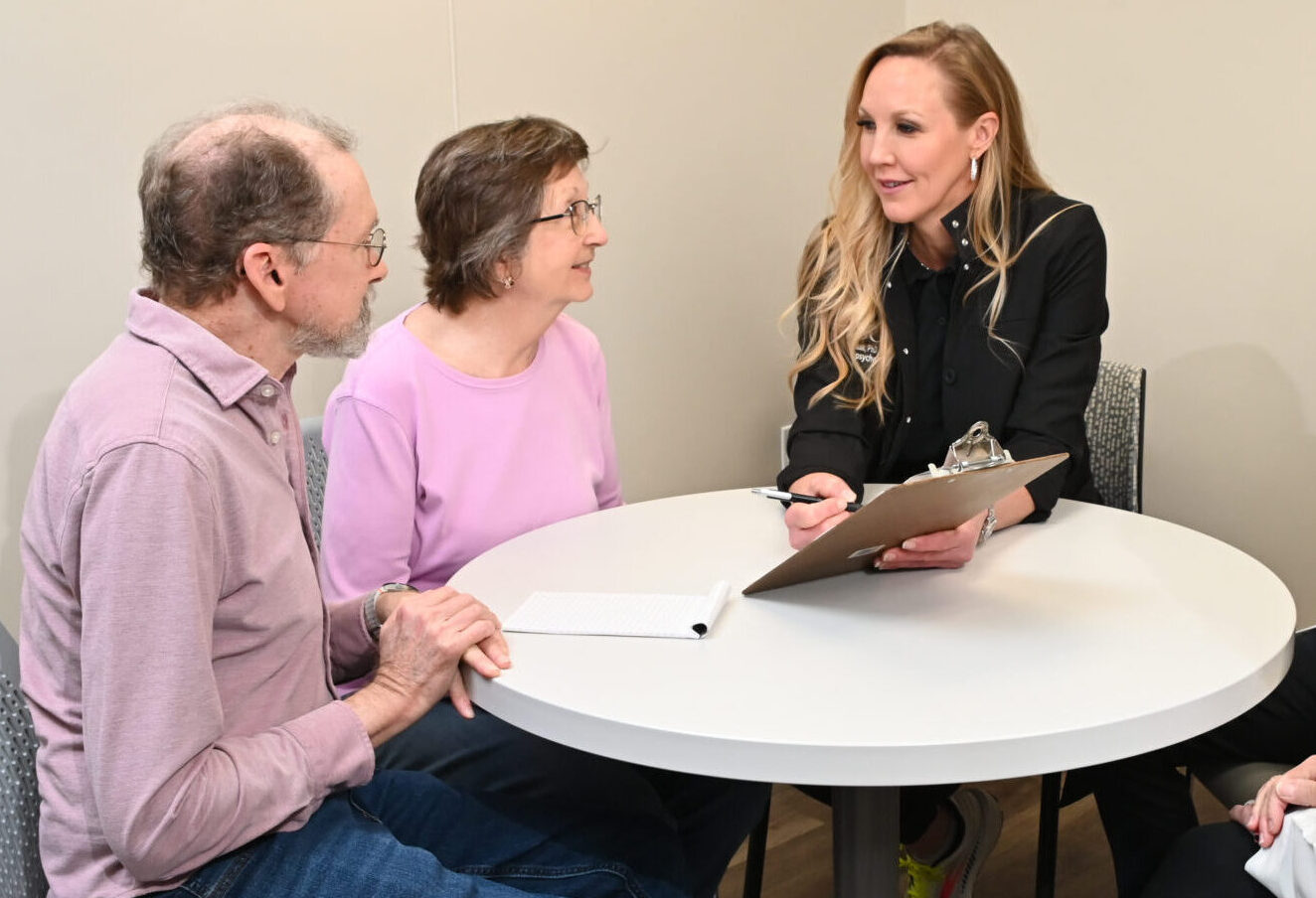 Dr. April Wiechmann counseling patient and spouse 