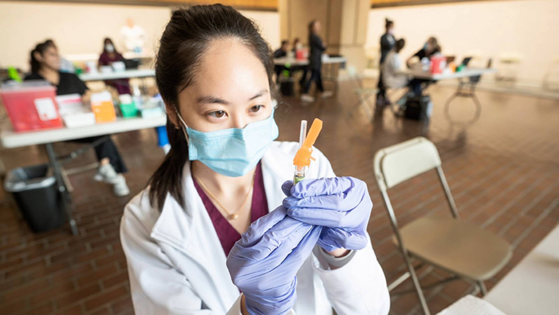 Medical provider drawing up a vaccine