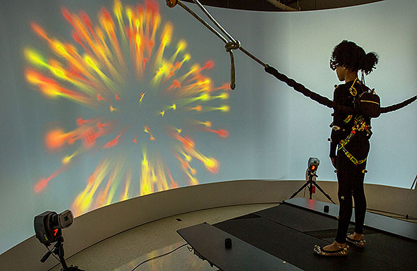 An image of a girl using an eye tracker as sensory processing.