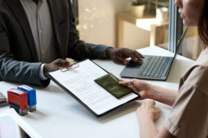 Woman Giving Her Documents In Visa Centre