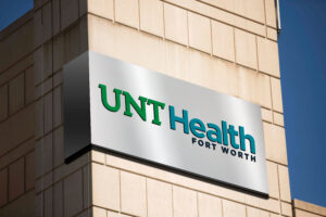 Artist representation of how the new UNT Health logo would look in full color on a building
