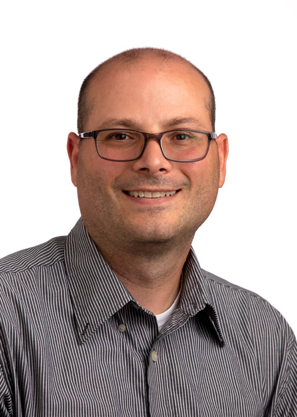 Steven Bartolotta headshot wearing a gray shirt