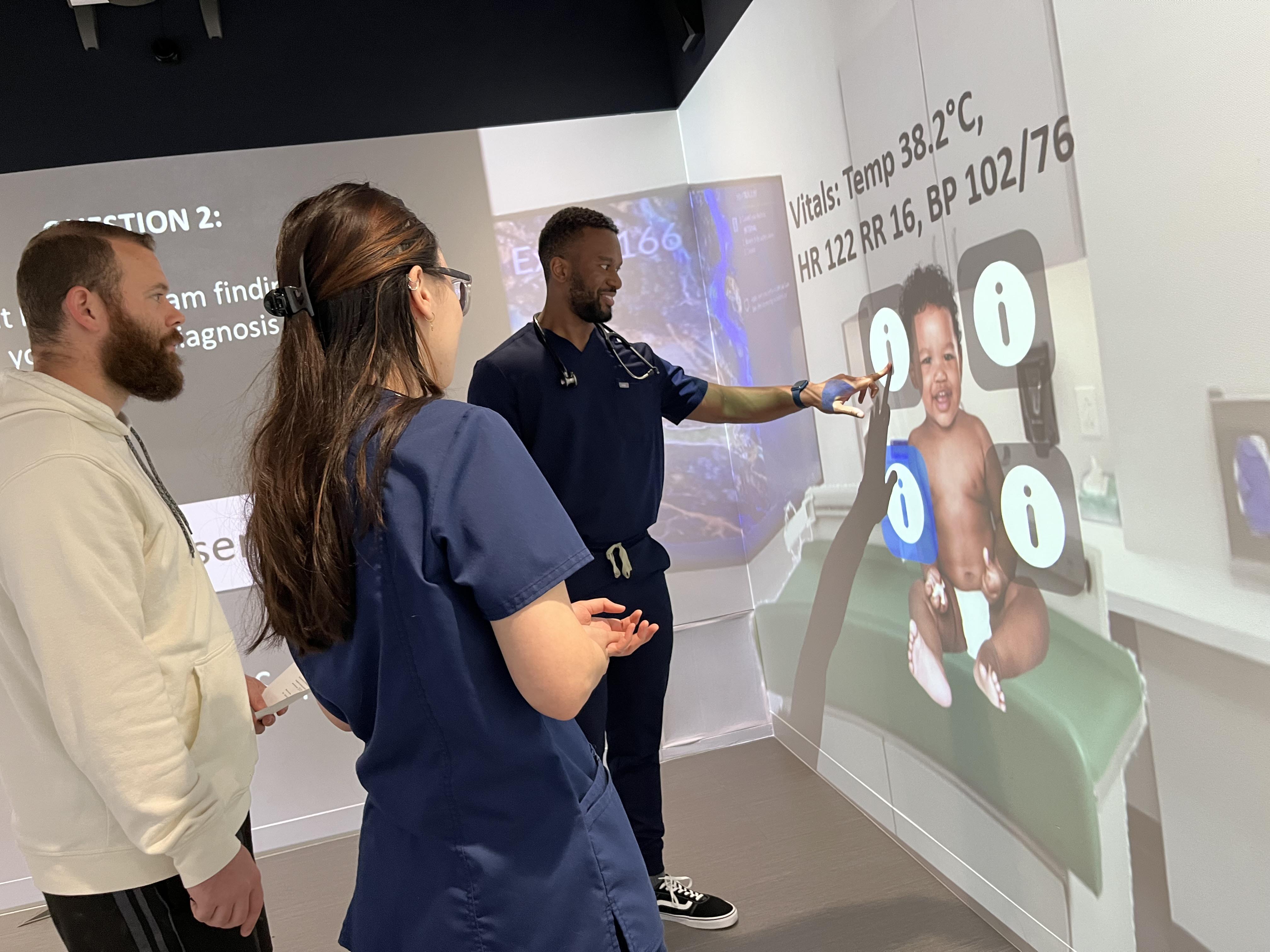 TCOM students in sim lab