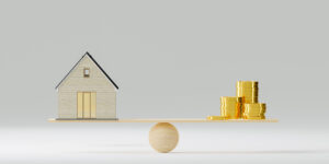 Home And Money Coins Stack On Wood Scale. Property Investment And House Mortgage Financial Real Estate Concept. Real Estate Money. 3d Illustration